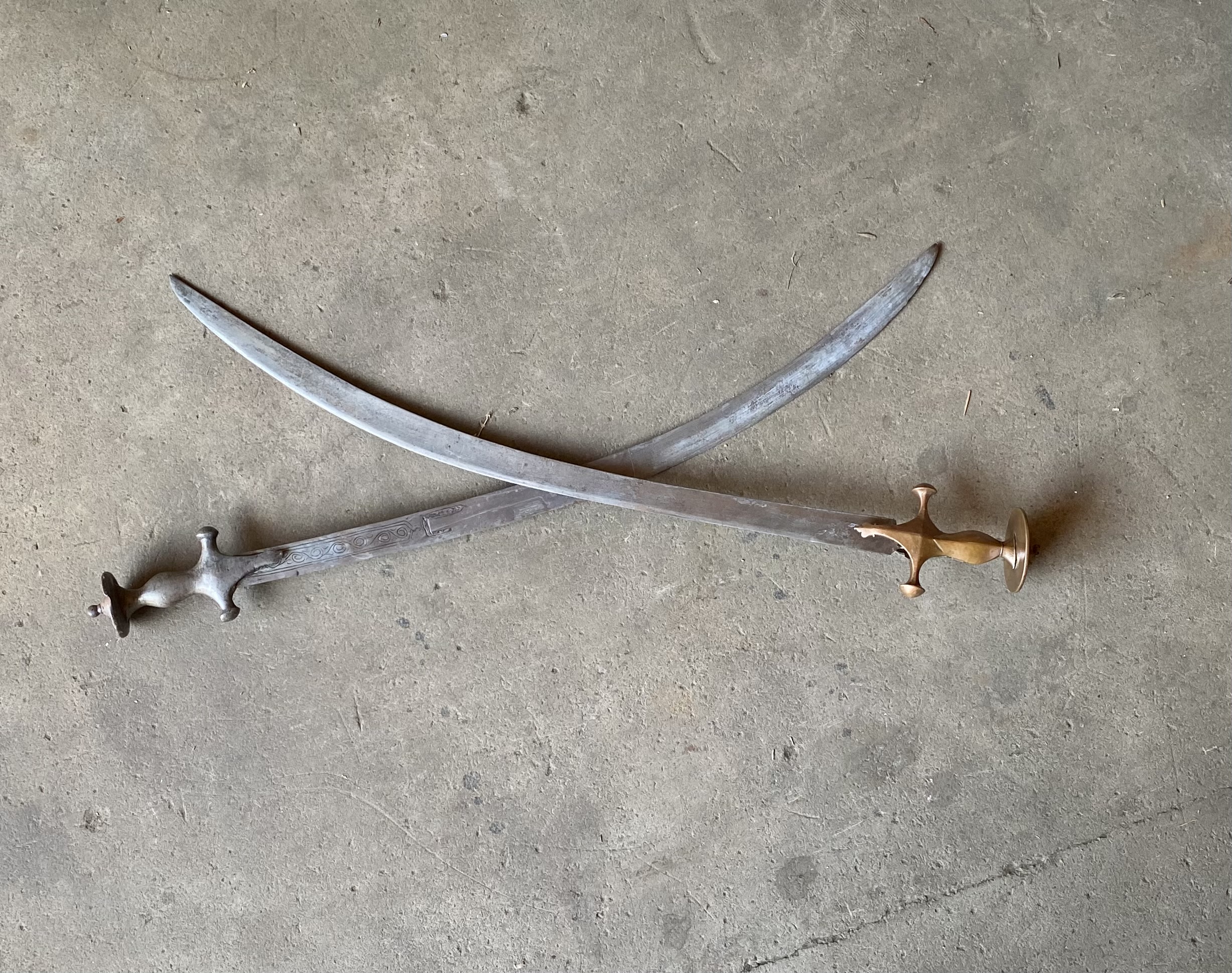Lot 214: Pair of Antique Indo-Persian Tulwar Curved Swords – 18th/19th C. Iron & Brass Hilts