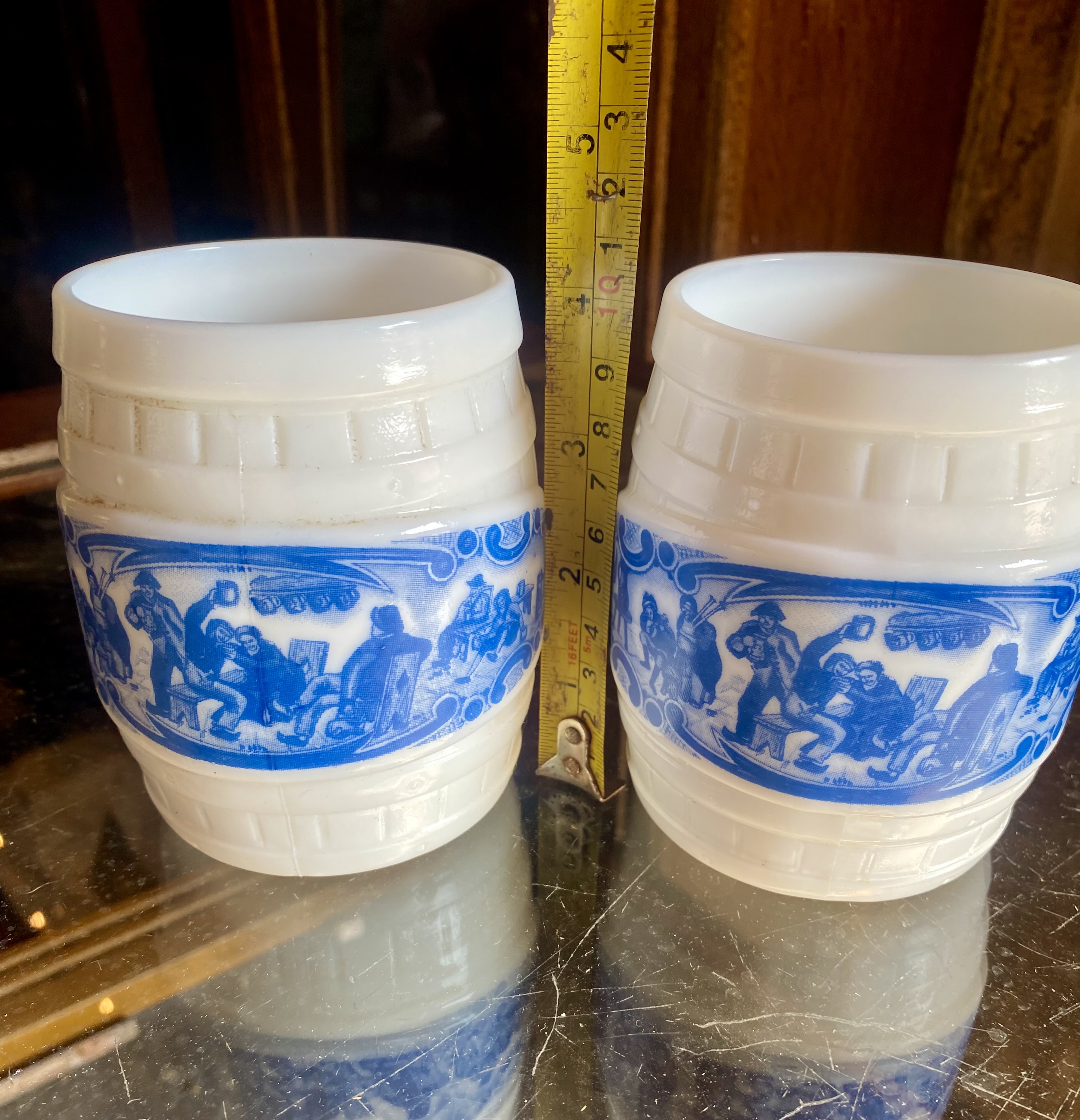 Lot 253: Pair of Vintage White Milk Glass Barrel Mugs - Blue Tavern / Pub Scene Steins (10.5cm)