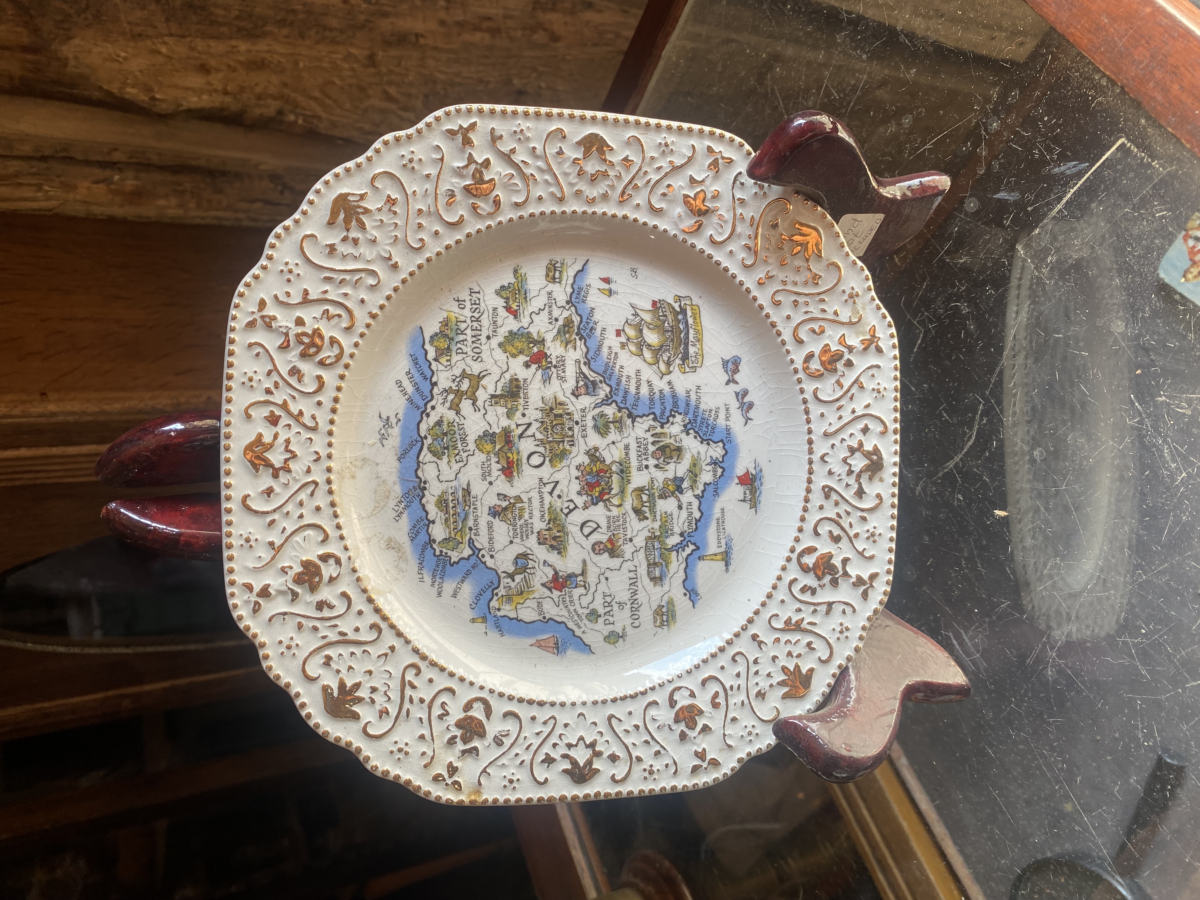 Lot 246: Vintage Britannia Designs Devon Pictorial Map Plate - Gold Filigree Border (21.5cm)